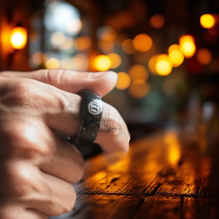 Spy Wars Fidget Ring Mechanic-I by StressCrate – worn on finger in bar lighting, magnetic fidget ring for stress relief