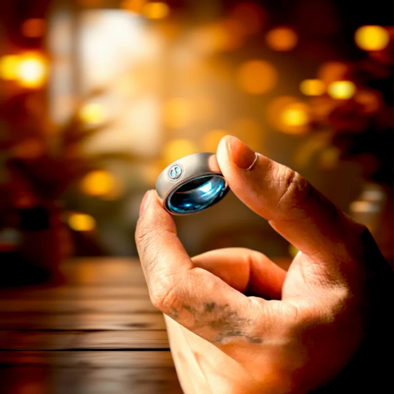 Spy Wars Fidget Ring Mechanic-I by StressCrate – titanium blue edition held in hand, magnetic stress relief ring