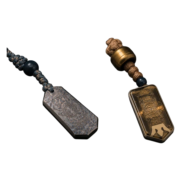 Two wearable EDC fidget pendants with cords and tactile metal details.